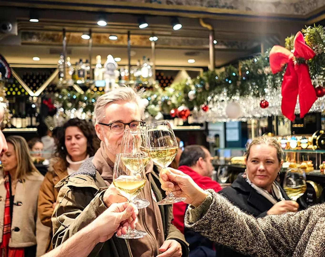 Group toasting drinks together during a food tour experience
